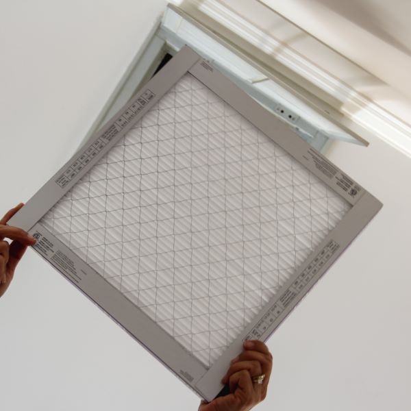 homeowner woman changing home air conditioning fil 2025 01 16 11 16 45 utc